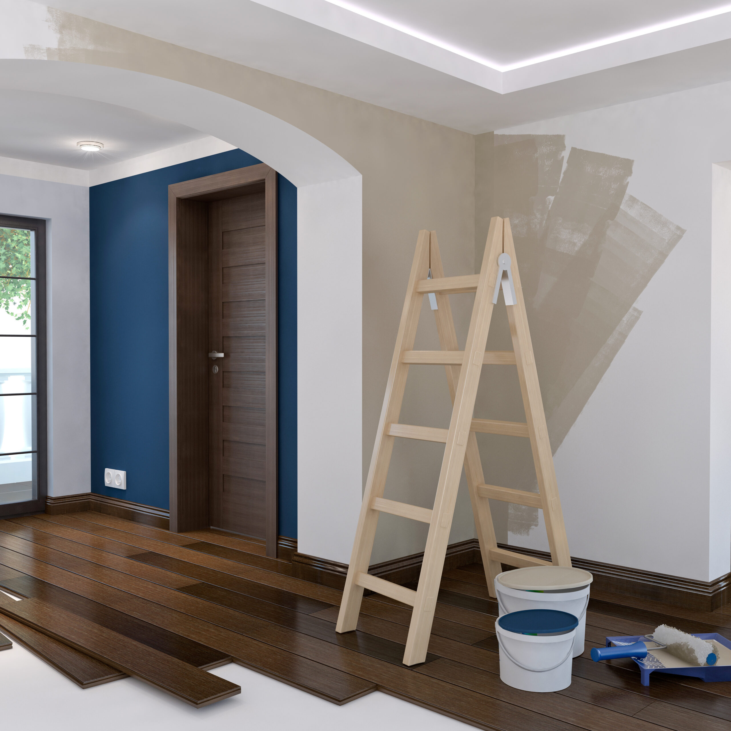 Rénovation intérieure : peinture beige testée sur mur blanc, échelle en bois, pots de peinture et pose de parquet bois foncé en cours.